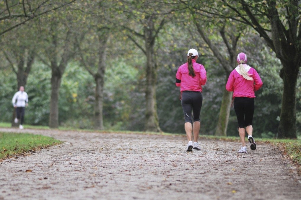 Girls running in autumn fog