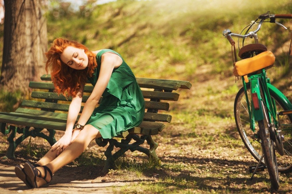 woman sitting on park bench